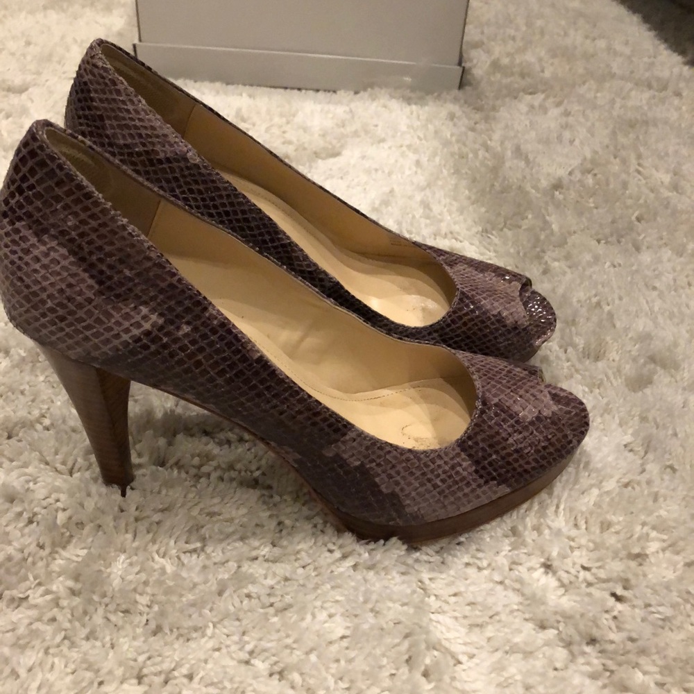 Gorgeous Calvin Klein peep toe snakeskin heels.